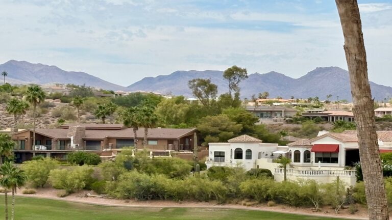 Aerial view of Fountain Hills Arizona with the golf course community and Fountain Hills mountains.