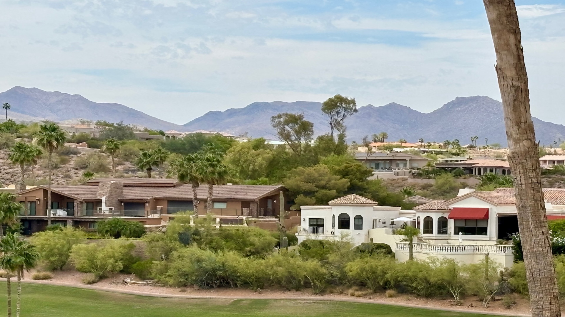 Aerial view of Fountain Hills Arizona with the golf course community and Fountain Hills mountains.